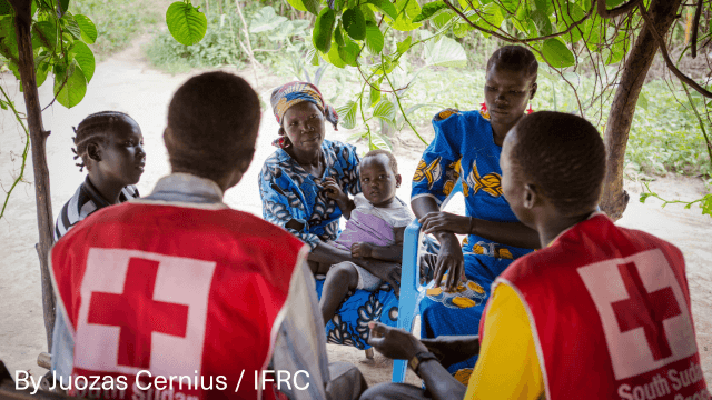 Woman and children fleeing Sudan