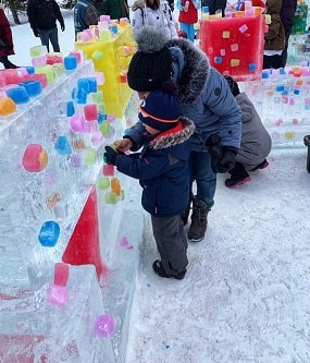 Shurooq explores an ice castle with her son at Winterlude