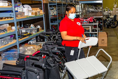 A Red Cross personnel assessing and taking inventory of health equipment