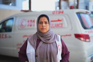 A headshot of Tahrer standing in front of an ambulance.