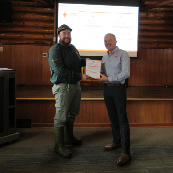 Reid Ahntholz with a Red Cross Rescue Award certificate for saving a life at Riding Mountain National Park.