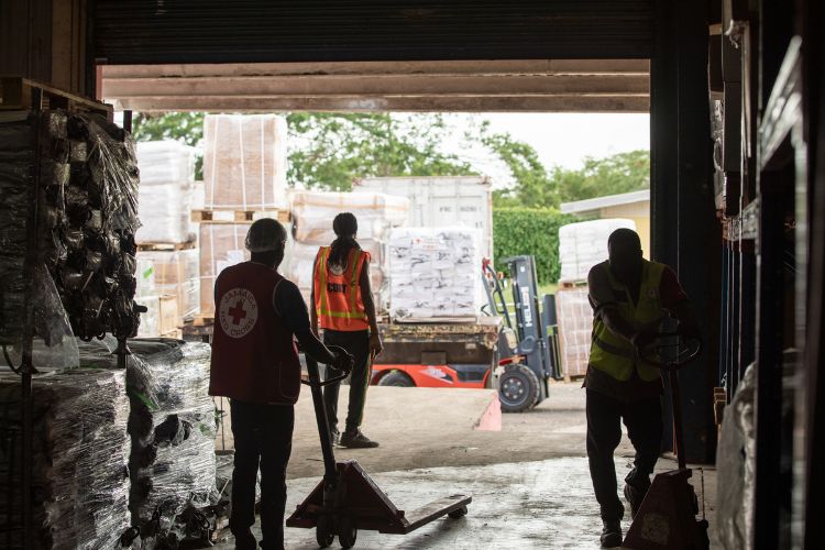 A shipment of supplies being unloaded into the warehouse at the Jamaican Red Cross headquarters.