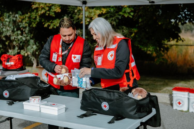 Canadian Red Cross personnel preparing emergency kits.
