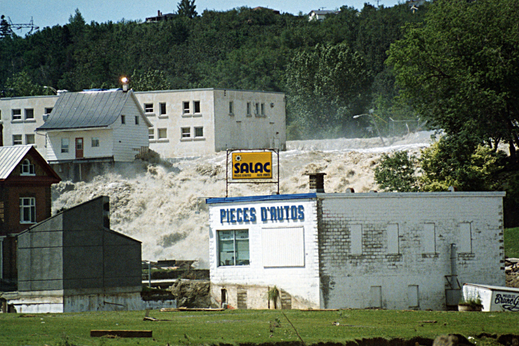 The famous “Little White House” of Chicoutimi, photographed at the height of the Saguenay Flood in July 1996.