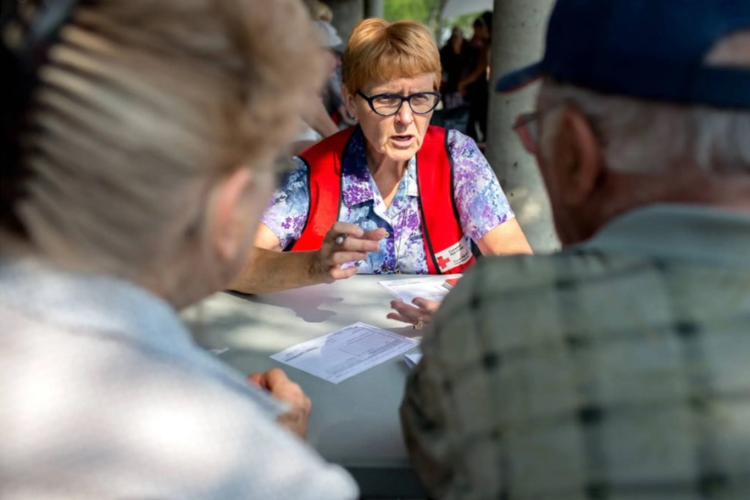 Deborah Chmara volunteering on the fielf