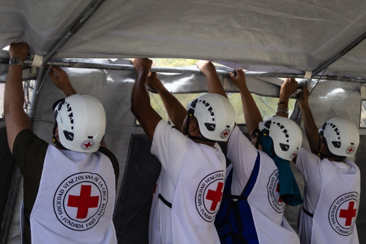 Venezuelan Red Cross teams set up tents for a field hospital in La Guaira.