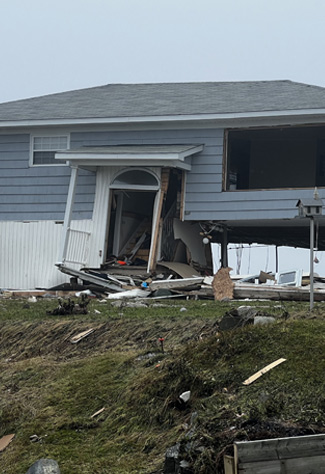 A home is significantly damaged after Hurricane Fiona.