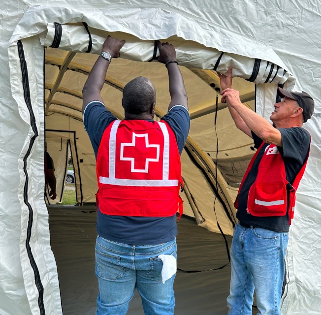 Technicians set up the tents at the Re-Entre Centre in Jasper