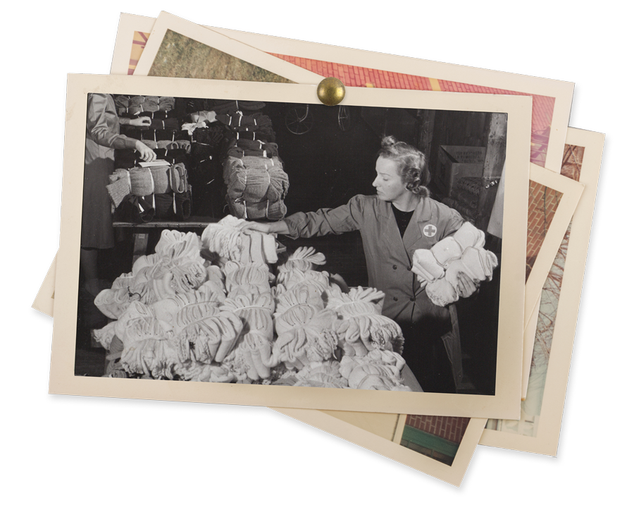 A Canadian Red Cross woman sorting linen supplies.