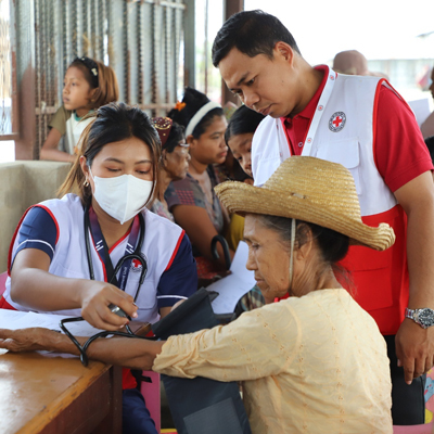 A woman receiving medical care from the Red Cross amid the humanitarian crisis in Myanmar.
