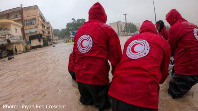 Five people with the Libyan Red Crescent assist during the flooding.