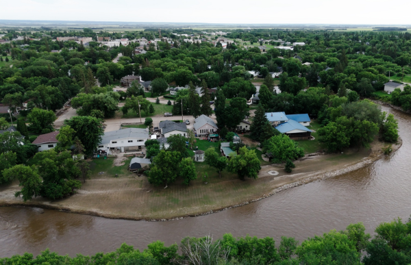 Aerial view of houses along a nearby body of water.