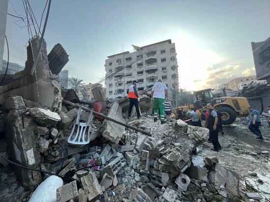 A group of people standing on a pile of rubble