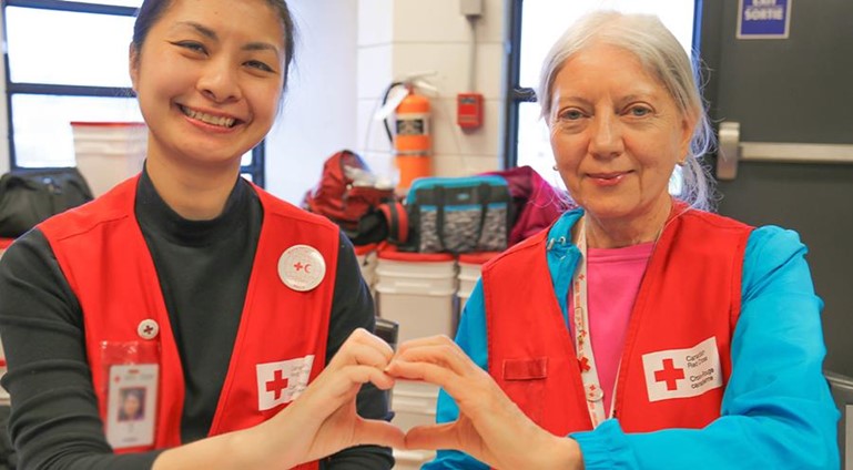 Smiling Red Cross volunteers