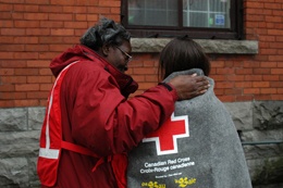 Canadian Red Cross Volunteer with recipient