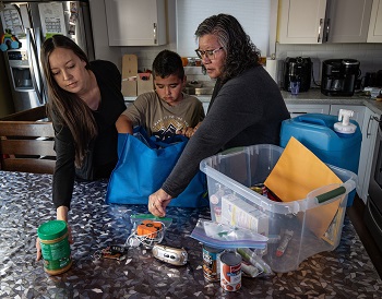 Family unloading groceries