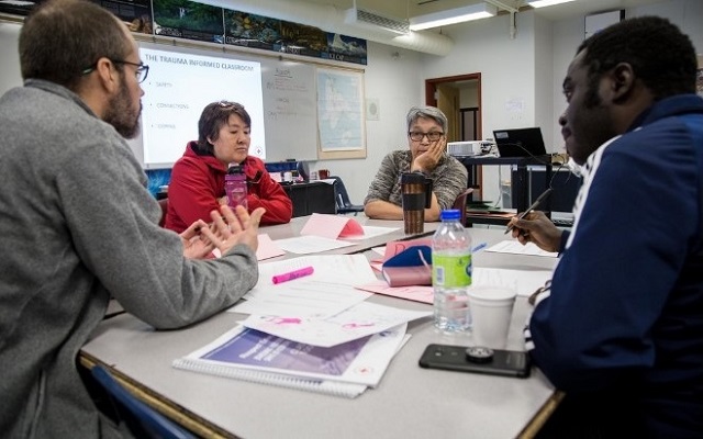 People at a table having a meeting