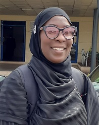 Woman in glasses and wearing all black