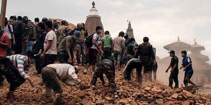 A group of people on a disaster zone after an earthquake